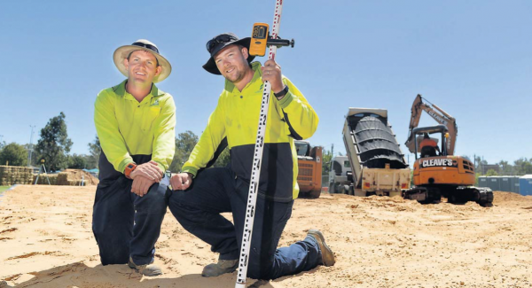 Under construction: Greater Shepparton City Council parks, sport and recreation team members Paul Parsons and Louis Worm at the beach volleyball courts being built at Victoria Park Lake.
