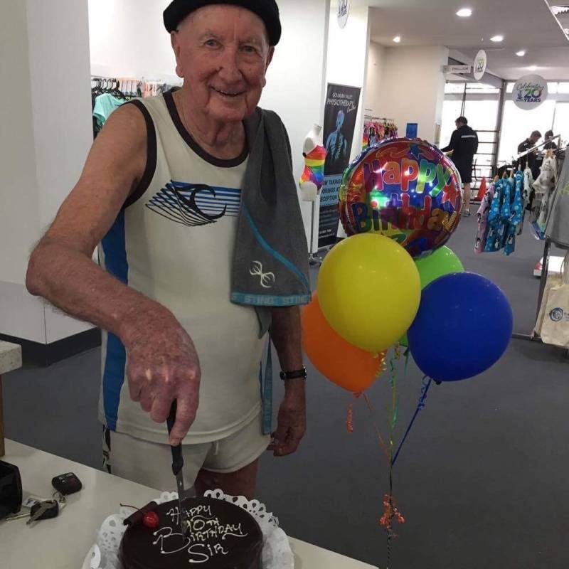 90 year old Aquamoves Member Kevin Holden cuts his Birthday Cake.
