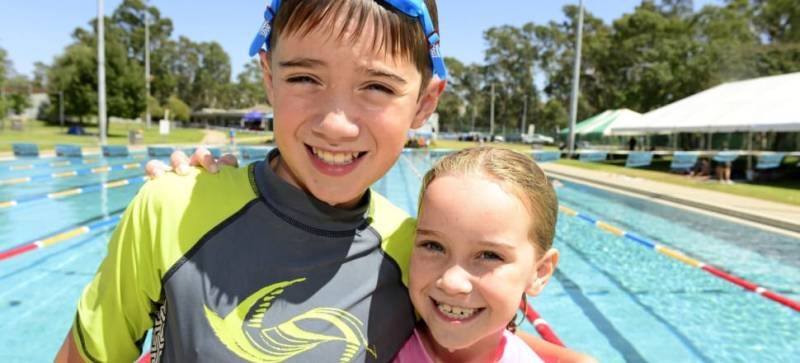 Cheer squad: Charlie, 10, and Violet Higgins, 7, enjoy hopping in the pool.