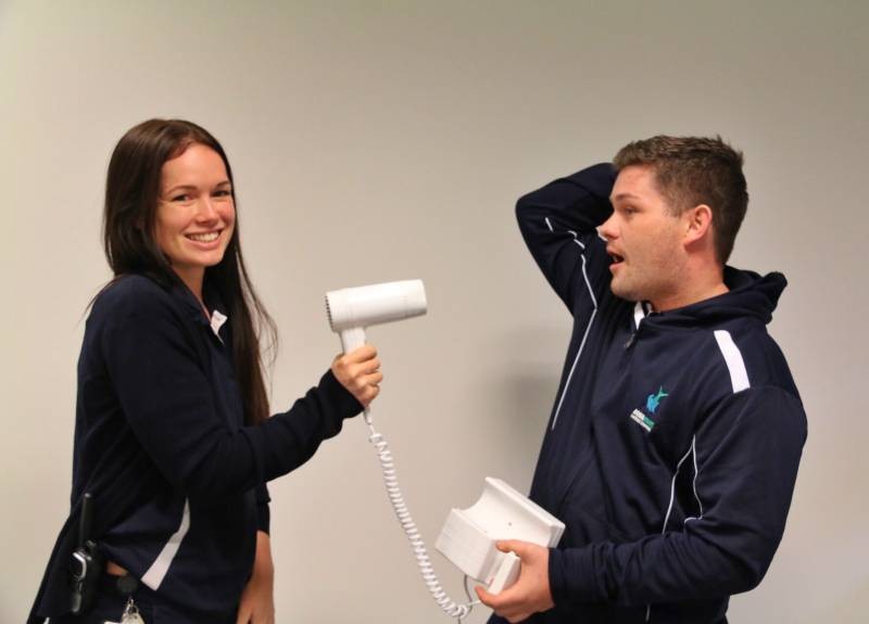 BLOWN AWAY: Duty Supervisor Claire and Operations Officer Tim trying out one of the new hairdryers.